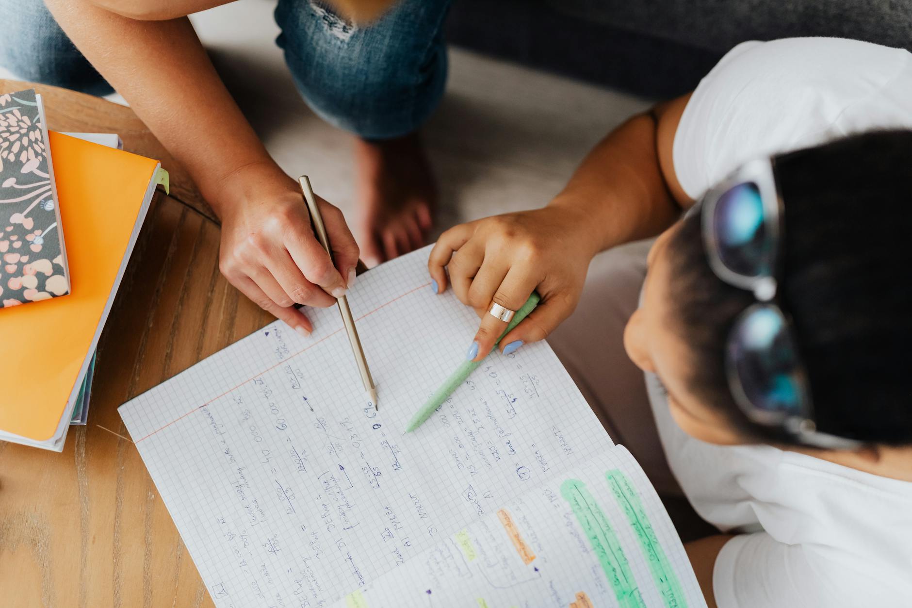 overhead shot of teacher teaching a student